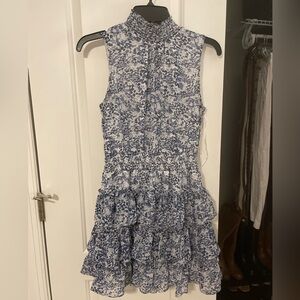 Sleeveless blue ruffled dress with high neck